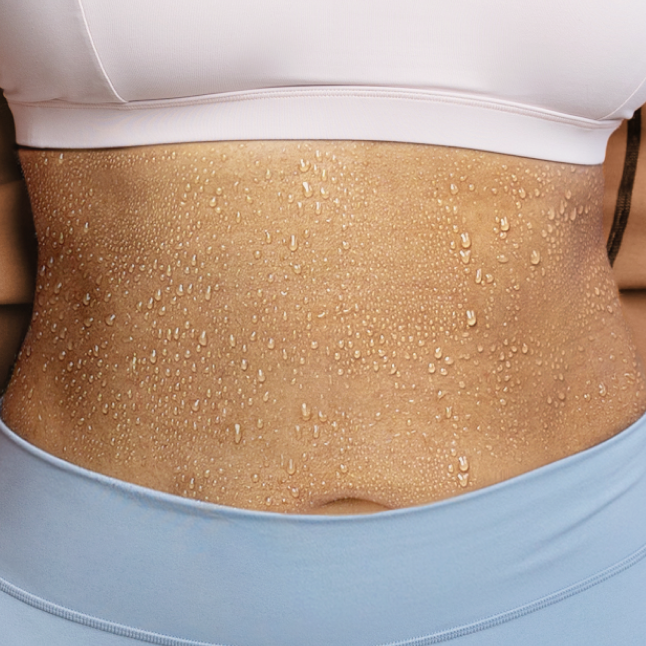 A model showing sweat on their abdomen.